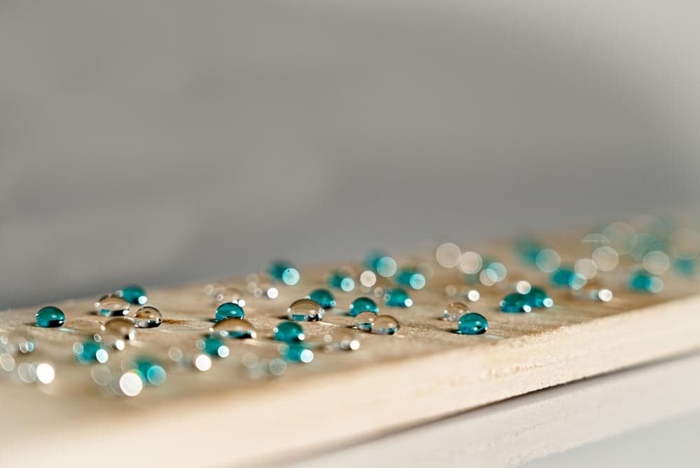 Water beading on a natural wood sample
