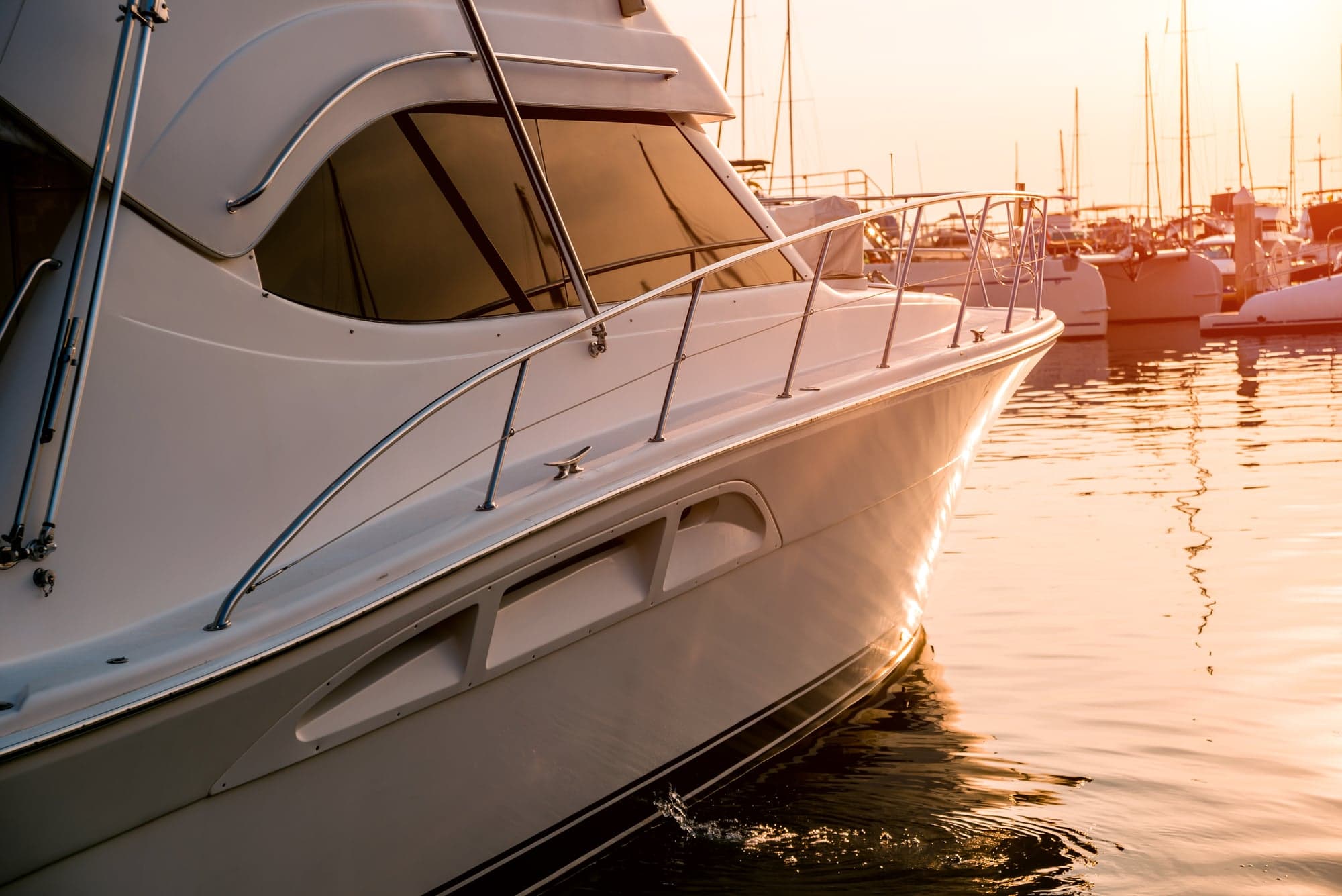 Motor yacht moored at sunset